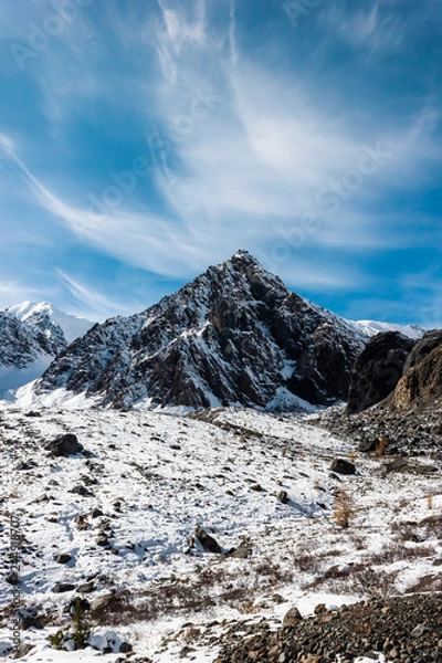 Fototapeta Top of mountain under snow and blue sky. Climbing the rocks, alipinism. Winter panorama of Altai mountain gorge.