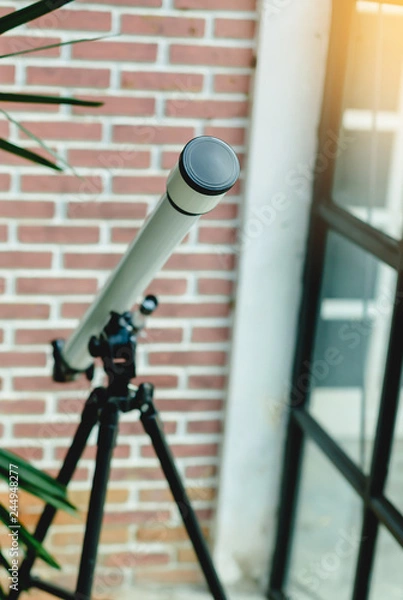 Obraz white telescope with brick wall
