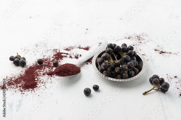 Obraz Aroniabeeren und Aroniapulver