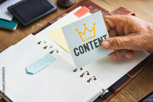 Obraz Senior hand holding a Content sticky note