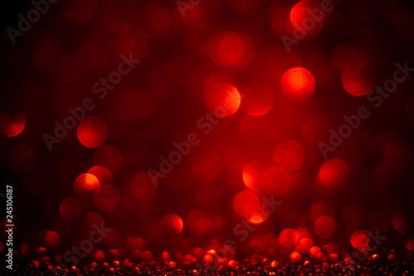 Fototapeta Red bokeh and red background. Valentine's day red lights defocused concept.