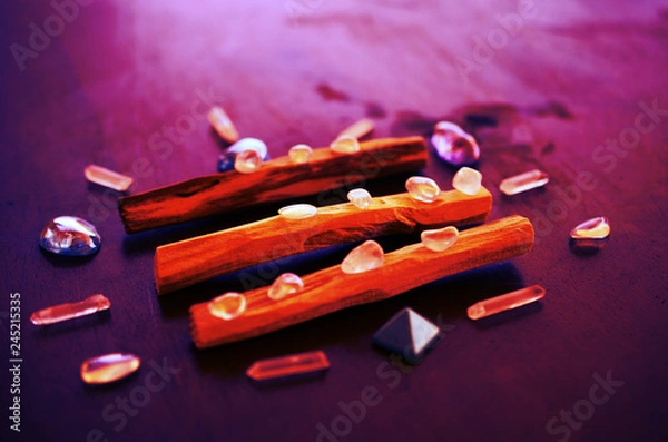 Fototapeta Hipster healing crystal display, bright shiny gems and stones. Witchy crystal healing and meditation. Sacred space, Wiccan alter. Clear quartz, aquaaura, rainbow aura quartz. 