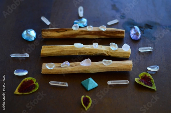 Fototapeta Hipster healing crystal display, bright shiny gems and stones. Witchy crystal healing and meditation. Sacred space, Wiccan alter. Clear quartz, aquaaura, rainbow aura quartz. 