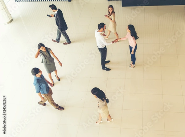 Obraz Top view of Young business people walking and standing separate discussion meeting on pathway before starting work in their office .Business communication lifestyle concept