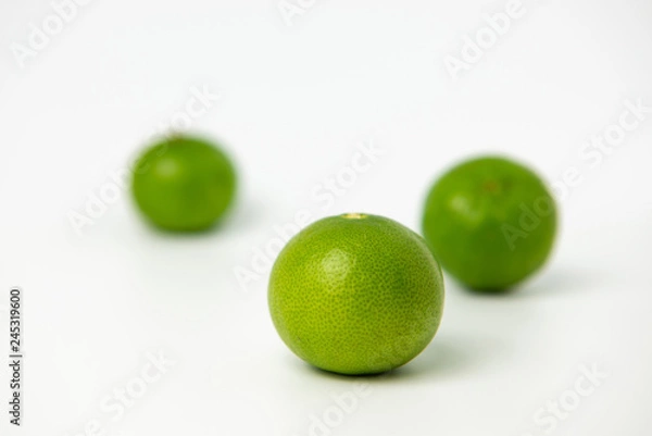 Obraz Limes with slices isolated on white background