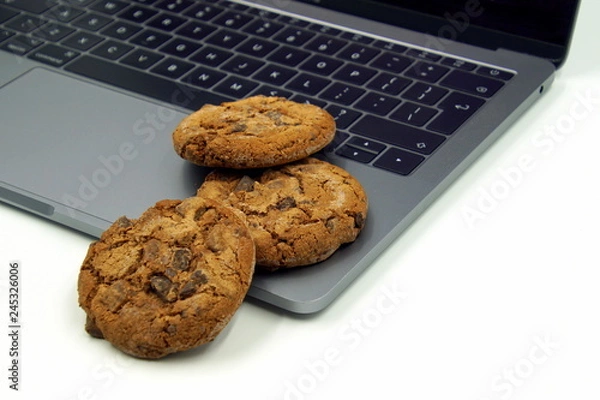 Obraz Cookies on a computer keyboard. Concept of internet cookies