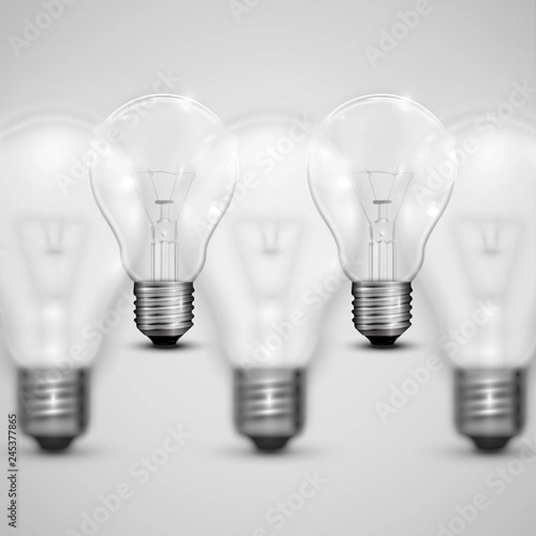 Fototapeta Realistic light bulbs with blurred ones, vector illustration