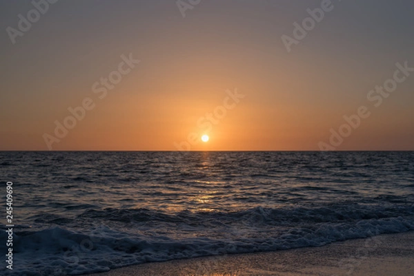 Obraz Calm dim sunset over ocean