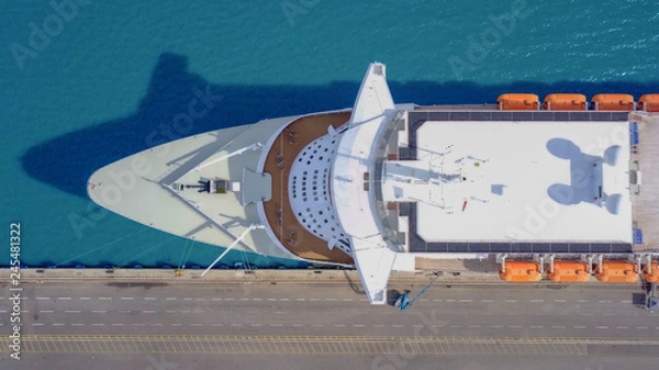 Fototapeta Large cruise ship docked at port - Top down aerial image.