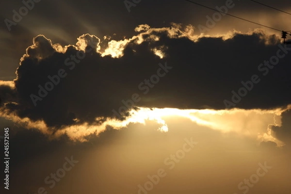 Fototapeta the sun behind the cloud