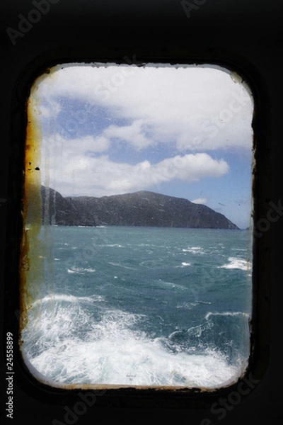 Fototapeta Ship window and rough sea