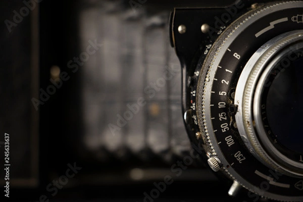 Fototapeta Bellows analogue camera on the black background and it like vintage or retro concept.