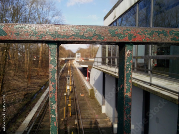 Obraz View on the railroad through railing