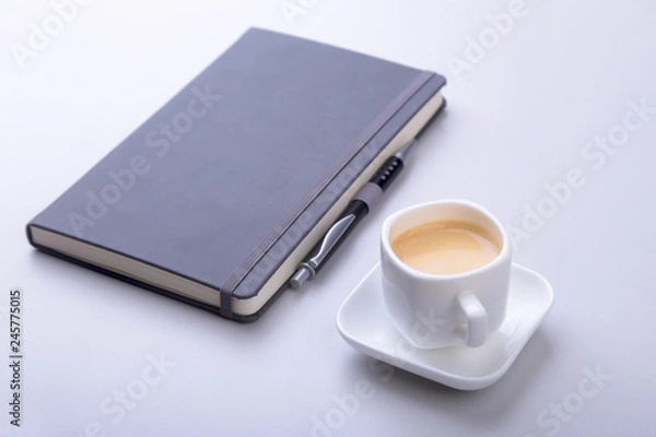 Obraz office table with notebook, computer keyboard,, cup of coffee, tablet pc. copy space.