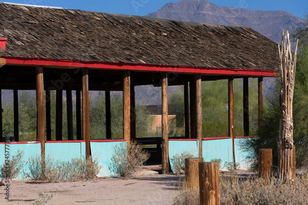Fototapeta Abandoned open structure with cedar shingle roof