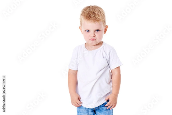 Fototapeta A cute little boy in a white T-shirt. The concept of promotional goods, inscriptions and drawings on clothes. Isolated on white background