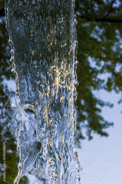 Fototapeta transparent falling water vertical flows, close up