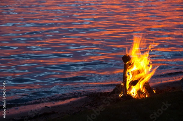 Obraz Fire on the beach at sunset