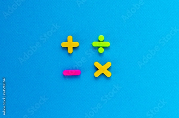 Obraz plus, minus, divide, multiply on blue background