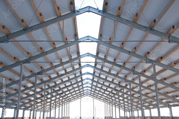 Fototapeta The element of the roof of the sandwich panels. Installation of the roof of the sandwich panels on the metal frame.