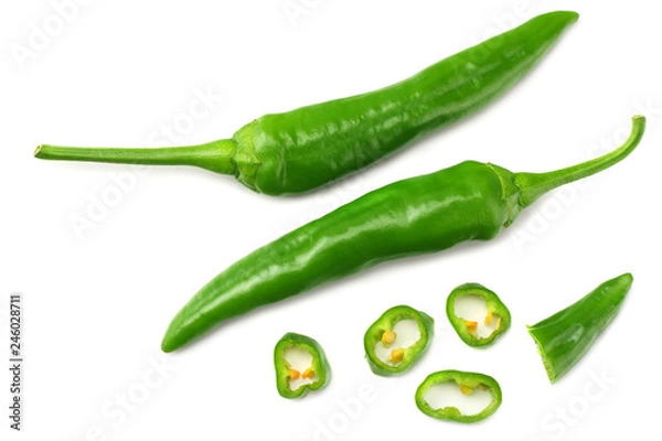 Fototapeta green hot chili peppers with slices isolated on white background top view
