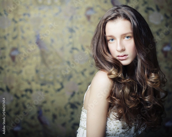 Fototapeta beautyful young woman with long curly hair