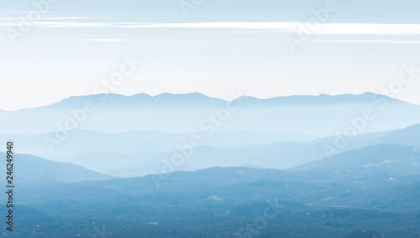 Obraz View of Mountains.  Layers of Hills in the haze and clouds.