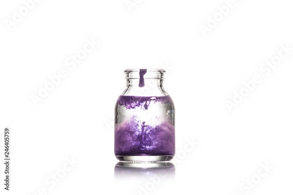 Fototapeta Studio shot of glass jar with water and purple splash isolated on white