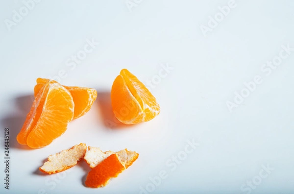 Fototapeta Slices of tangerine,mandarin isolated on white background 