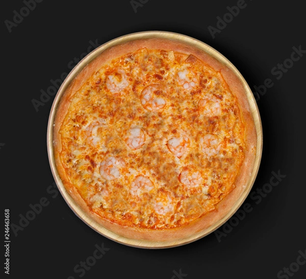Fototapeta Isolated image of pizza with shrimps and olives on a black background