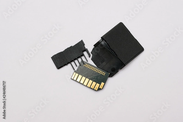 Obraz Broken memory cards on a white background.