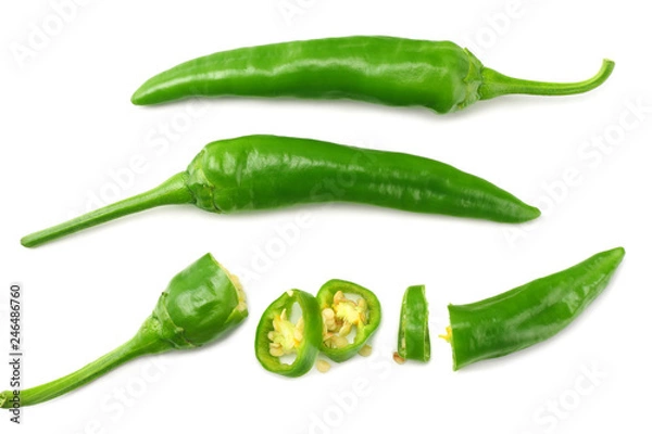 Fototapeta green hot chili peppers with slices isolated on white background top view