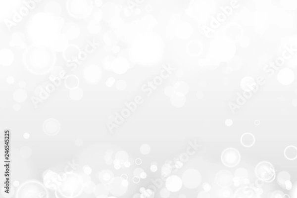 Fototapeta Silver and white bokeh lights defocused. Abstract background. Elegant, shiny, blurred light background. Magic christmas background. EPS 10.