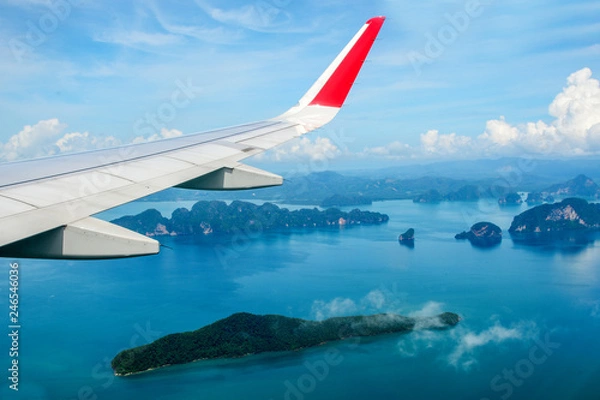 Fototapeta Tropical group of islands in Thailand as seen on window through window of an aicraft. Top view