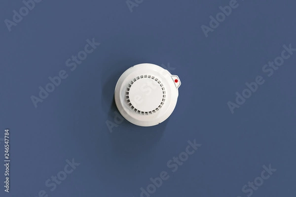 Obraz Smoke fire detected Smoke detector on dark blue. ceiling
