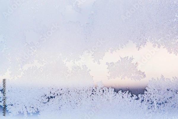Fototapeta Winter Window Pane Coated Shiny Icy Frost Patterns. Close up. Winter weather