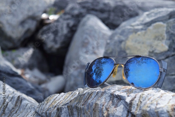 Obraz Black glasses placed on the stone.