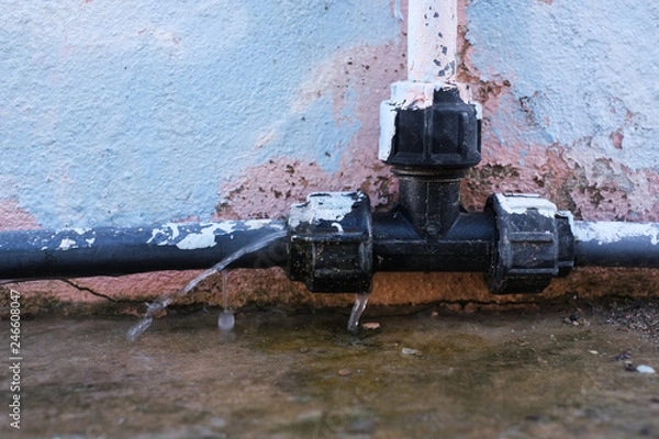 Obraz Water leakage  from old pipe.