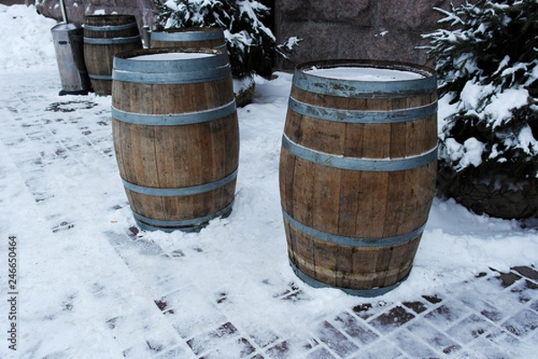 Fototapeta barrels of wood stand for drinks in the cafe in the winter