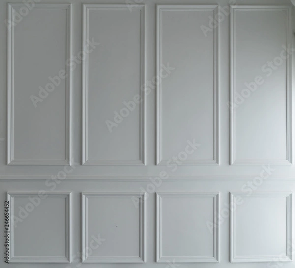 Fototapeta Classice wooden stripe frame install on white painted wall / background concept/ set scene / natural light