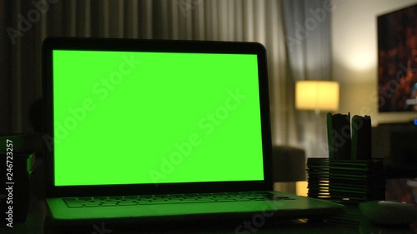 Obraz Laptop with green screen for replacement with blur background