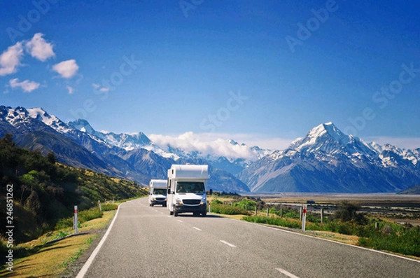 Fototapeta Two white caravan cars on the way in New Zealand. Traveling concept. Camper vans.