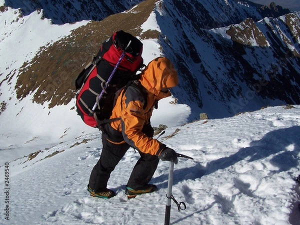 Fototapeta climber reaching the summit