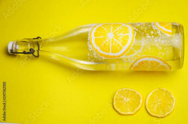 Obraz Water bottle and lemon