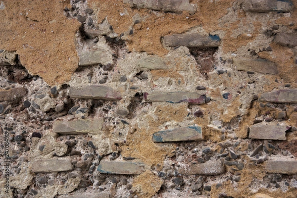 Fototapeta Texture of old wall with bricks in sight