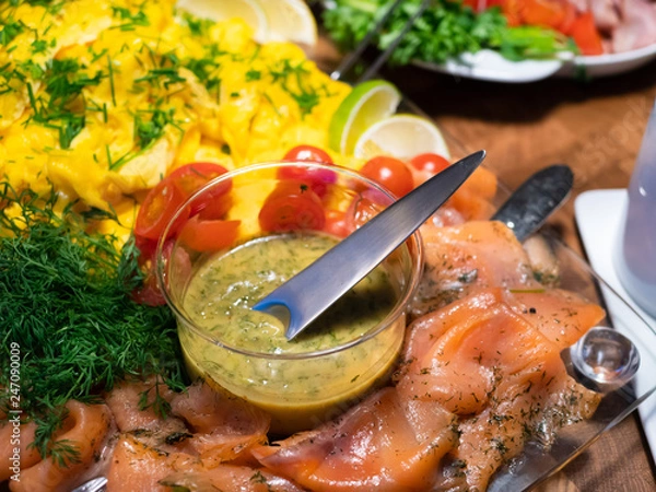 Fototapeta Scandinavian smorgasbord with gravlax and mustard sauce
