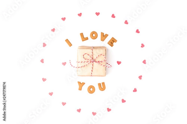 Obraz Valentine's day concept. Declaration of love, frame made of paper hearts. In the center gift in craft paper. Flat lay, top view, white background, isolated, copy space