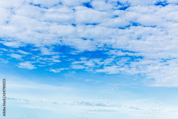 Fototapeta blue sky background with tiny clouds