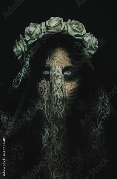 Fototapeta Creepy corpse zombie bride with white empty eyes on black background