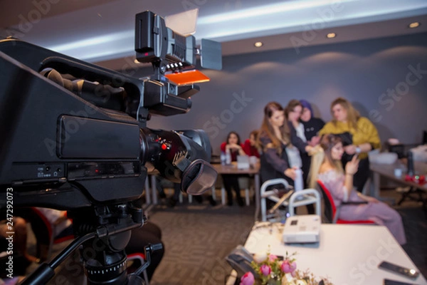 Fototapeta In front of the camera to recording vlog video live streaming at home.Business online influencer on social media concept. Makeup cosmetic at home. Focus on tripod mounted camera screen showing .